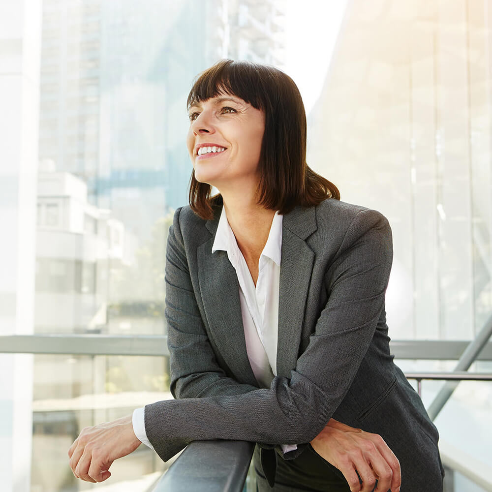 Professional coach smiling in a modern office setting
