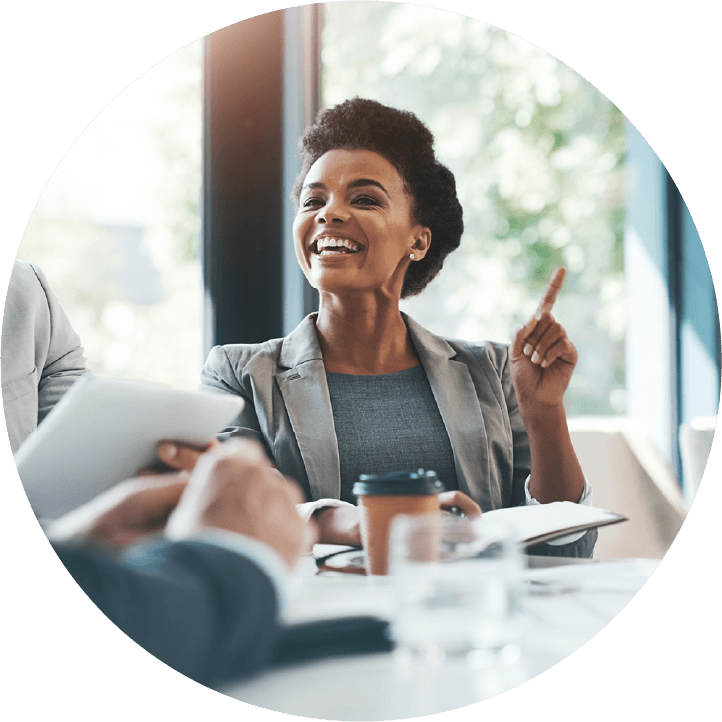 Sales professional laughing during a client meeting